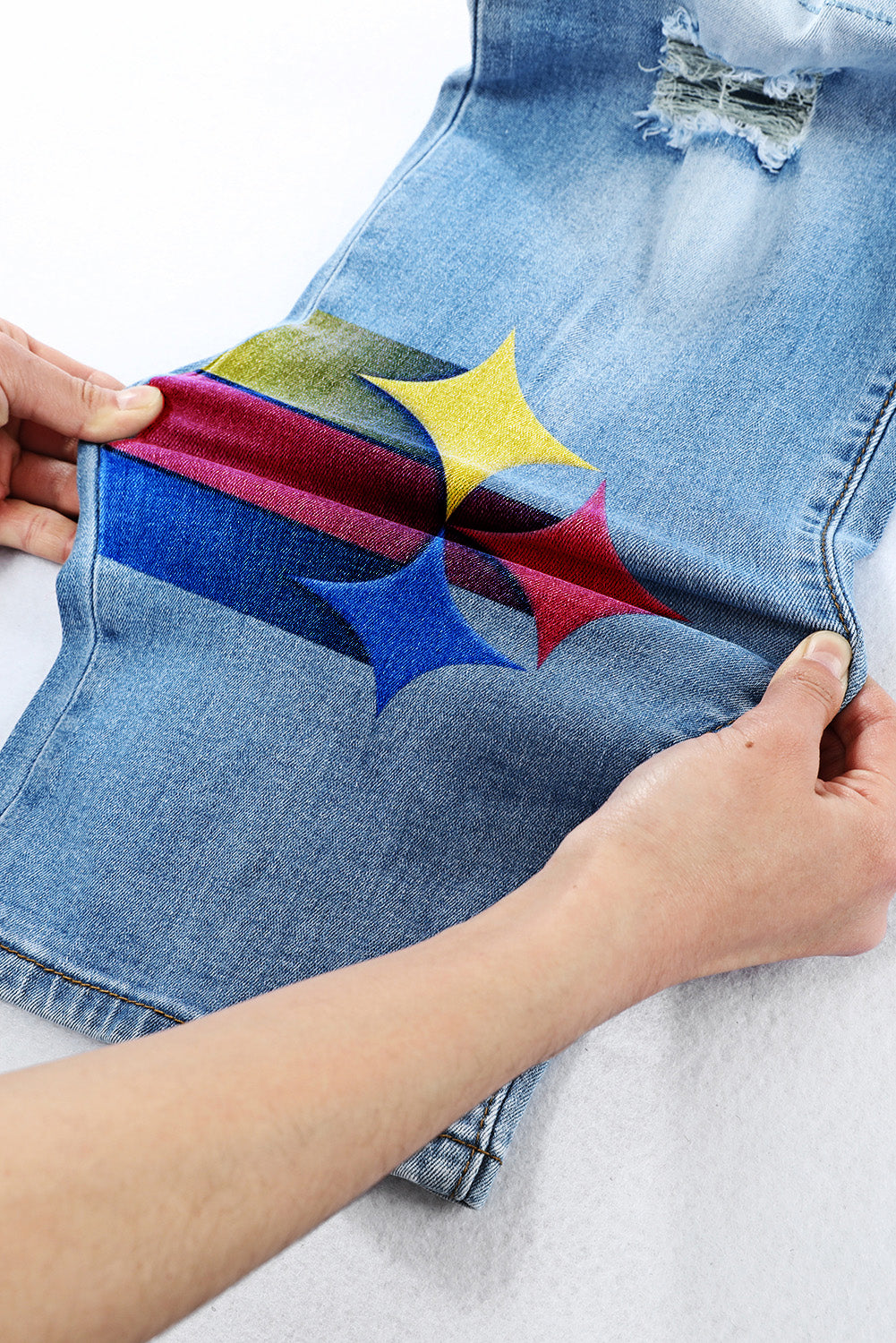 casual fashion perforated printed jeans