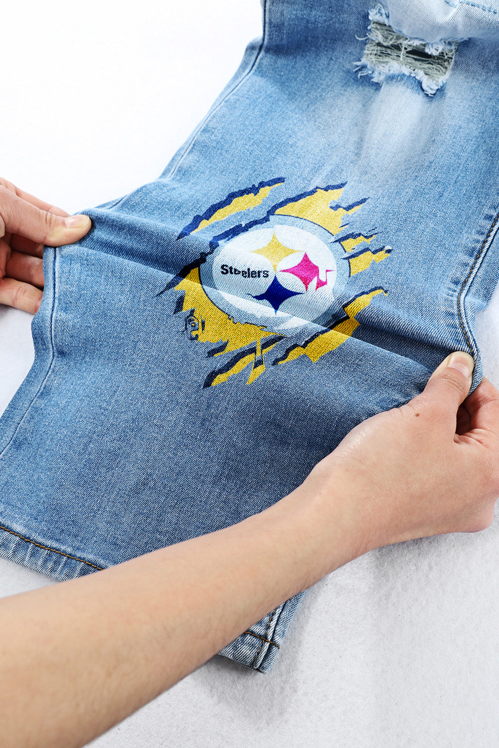 casual fashion perforated printed jeans